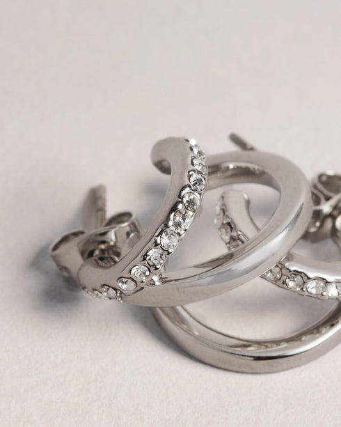 HELIAS-Jewellery-Need A New Go-to Piece? Meet Helias Our Dazzling Double Huggie Hoop Earrings. These Statement Earrings Feature A Striking Contrasting Texture With One Hoop Adorned With Shimmering Crystals For An Extra Touch Of Glamour. Double huggie hoop earrings Contrasting texture One crystal embellished hoop Engraved logo Stud back Comes in Ted Baker branded gift box- Ted Baker Romania
